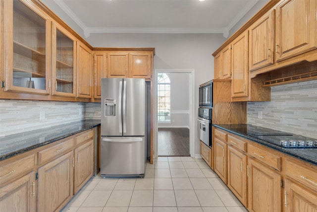 kitchen with tasteful backsplash, crown molding, black appliances, light tile patterned floors, and dark stone countertops