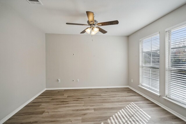 unfurnished room featuring ceiling fan and wood-type flooring