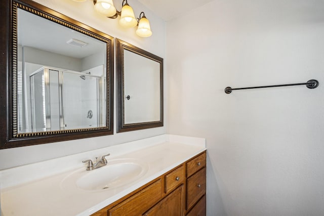 bathroom with vanity and an enclosed shower