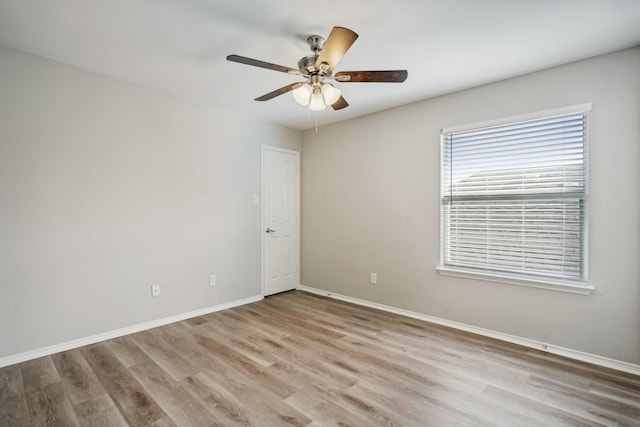 unfurnished room with ceiling fan and light wood-type flooring