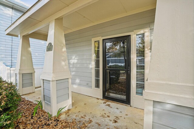 doorway to property with a porch