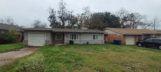 ranch-style house featuring a front lawn and a garage