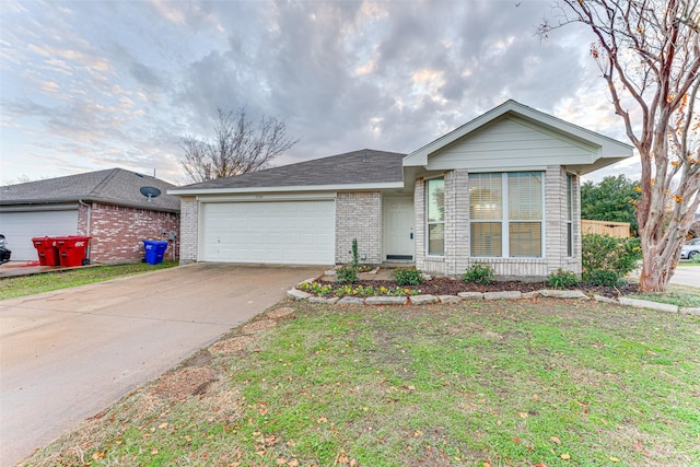 ranch-style home featuring a garage and a front lawn