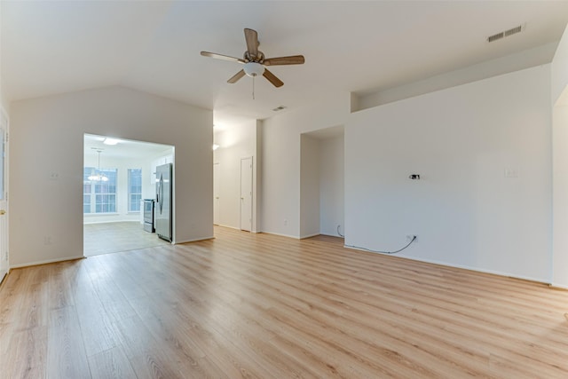 1501 Kelly Ln, Royse City, TX 75189 - unfurnished living room with light wood-style flooring, ceiling fan, and vaulted ceiling