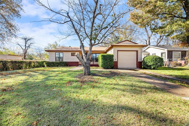 single story home featuring a front yard and a garage