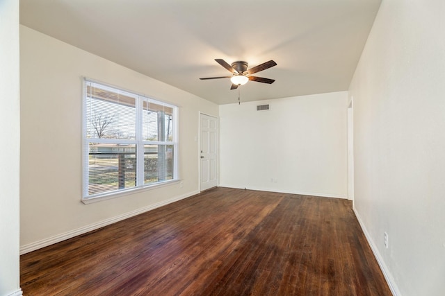 4855 Haas Dr, Dallas, TX 75216 - spare room with ceiling fan, dark wood finished floors, and baseboards