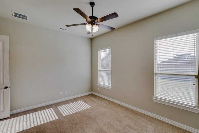 empty room with light carpet and ceiling fan