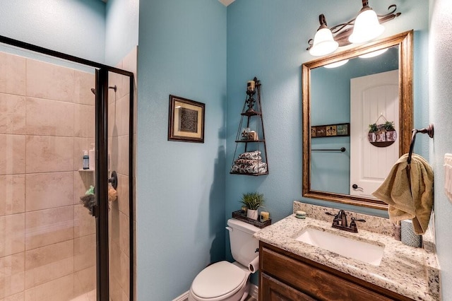 bathroom with walk in shower, vanity, and toilet