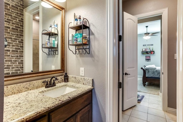 bathroom with ceiling fan, vanity, and tile patterned flooring