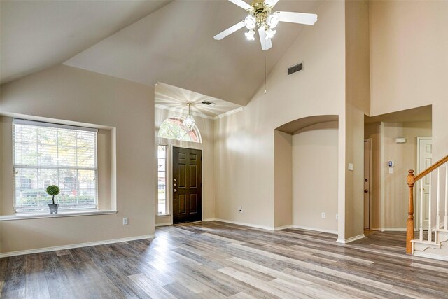 kitchen featuring backsplash, sink, appliances with stainless steel finishes, and vaulted ceiling