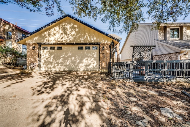 view of property exterior featuring a garage