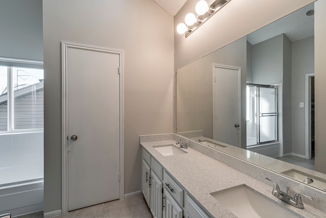 bathroom featuring tile patterned floors, separate shower and tub, and vanity