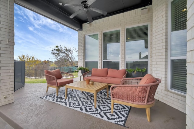 view of patio / terrace with an outdoor living space and ceiling fan