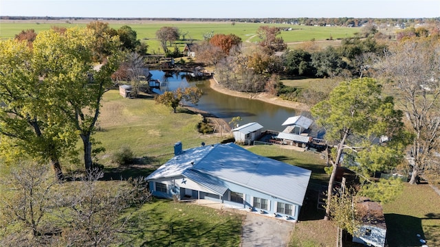 drone / aerial view featuring a rural view and a water view