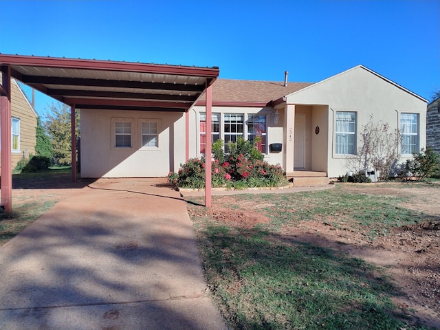 view of front of property with a carport