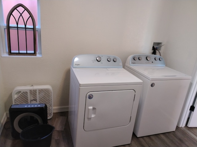 washroom featuring hardwood / wood-style flooring and washing machine and clothes dryer