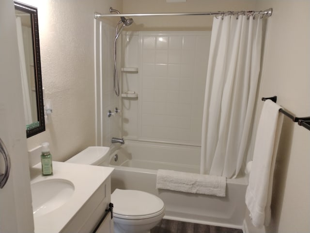 full bathroom with vanity, wood-type flooring, shower / bath combo, and toilet