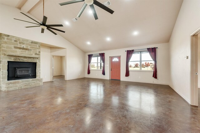 unfurnished living room with ceiling fan and high vaulted ceiling