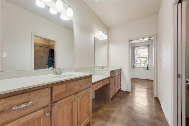 bathroom with vanity and concrete floors