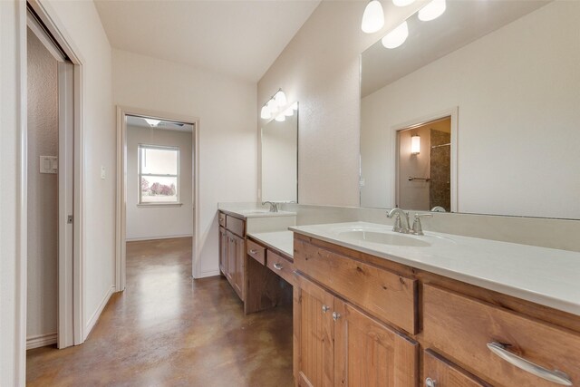 bathroom featuring concrete flooring and vanity