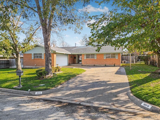 ranch-style home with a garage and a front yard