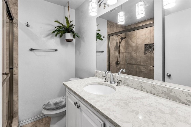 bathroom featuring walk in shower, tile patterned flooring, vanity, and toilet