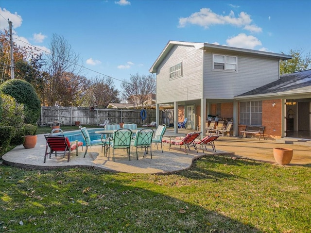 view of swimming pool featuring a yard and a patio area