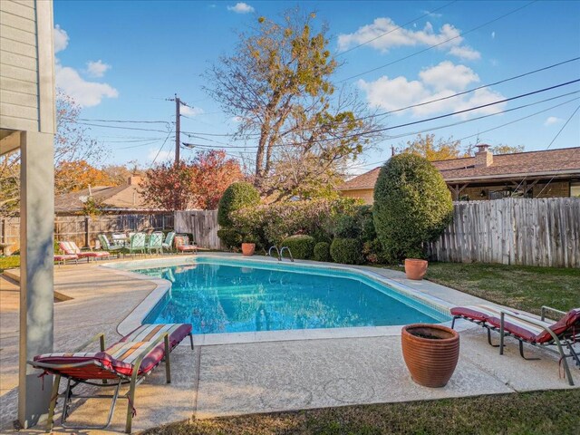 view of pool featuring a patio