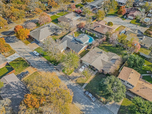 birds eye view of property with a residential view