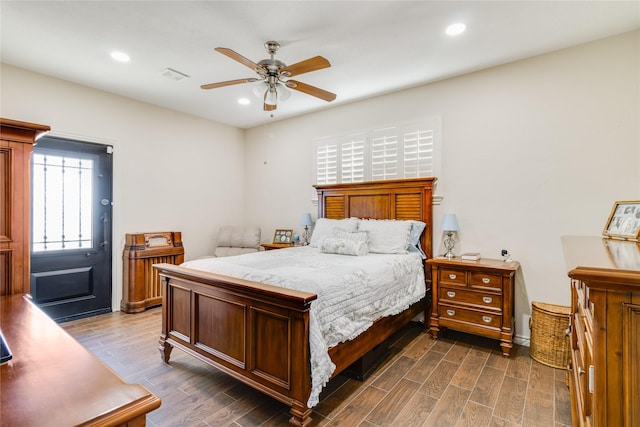 bedroom featuring ceiling fan and dark hardwood / wood-style flooring