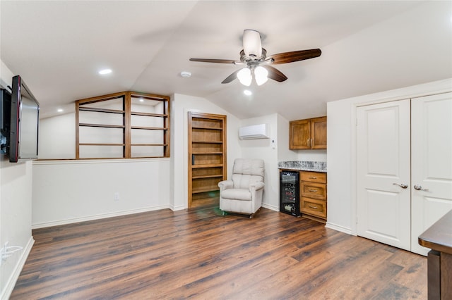 interior space with lofted ceiling, wine cooler, dark hardwood / wood-style floors, ceiling fan, and a wall mounted AC