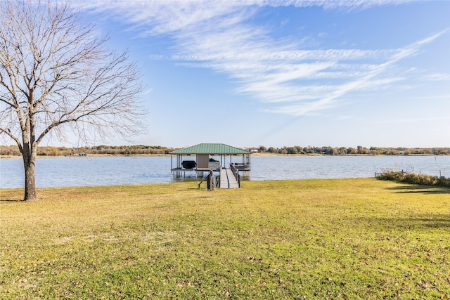 view of dock featuring a water view and a lawn