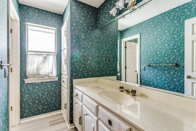 bathroom featuring vanity and wood-type flooring