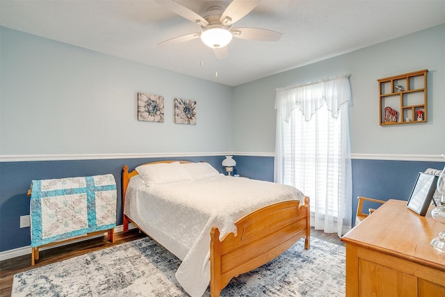 bedroom with hardwood / wood-style floors and ceiling fan