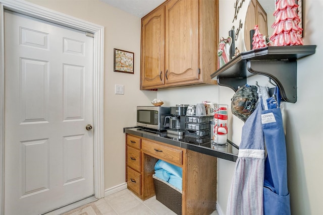 kitchen with light tile patterned floors