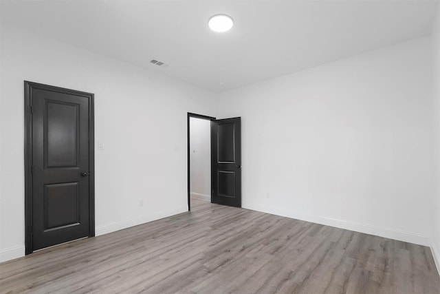 unfurnished room featuring light wood-type flooring