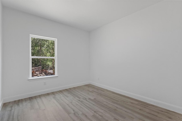 spare room with light hardwood / wood-style flooring