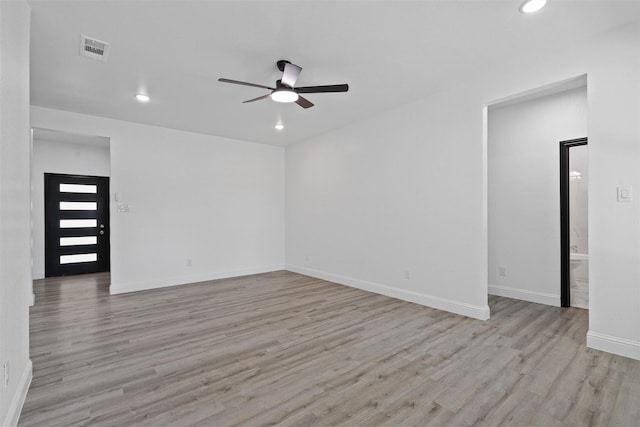 unfurnished room featuring light wood-type flooring and ceiling fan