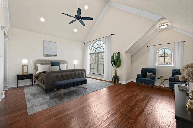 bedroom with crown molding, ceiling fan, dark wood-type flooring, and high vaulted ceiling