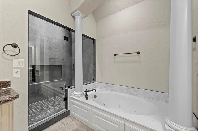 bathroom featuring tile patterned floors, vanity, and plus walk in shower