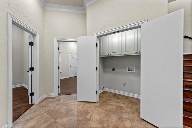 washroom with cabinets, hookup for a gas dryer, crown molding, hookup for a washing machine, and hookup for an electric dryer