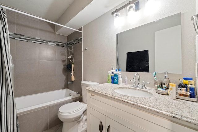 full bathroom featuring vanity, shower / bath combination with curtain, and toilet