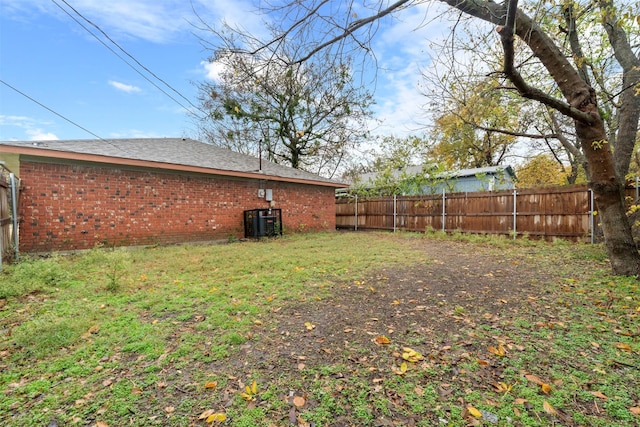 view of yard with central air condition unit