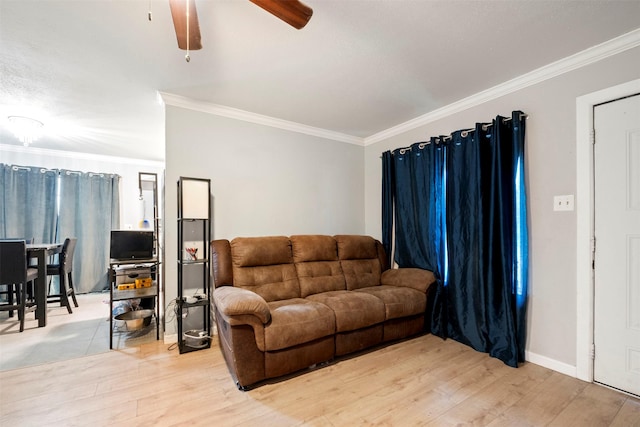 living room with hardwood / wood-style flooring and crown molding