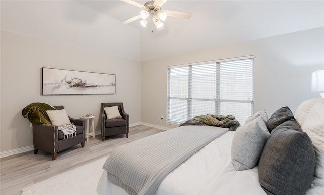 bedroom featuring ceiling fan, high vaulted ceiling, and light hardwood / wood-style floors