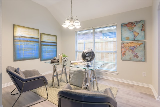 office space with a chandelier, light hardwood / wood-style floors, and vaulted ceiling