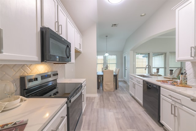 kitchen with white cabinetry and black appliances