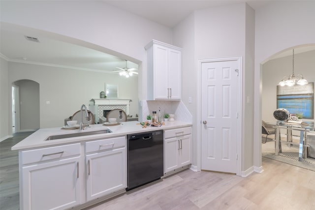 kitchen with dishwasher, ceiling fan with notable chandelier, sink, decorative backsplash, and white cabinetry