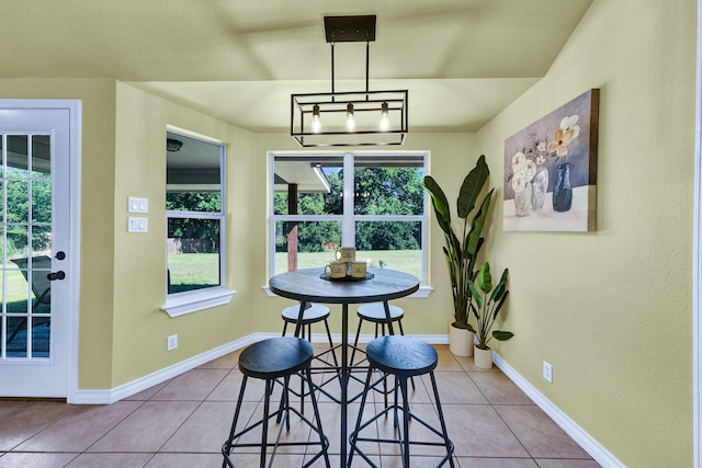 tiled dining room featuring a wealth of natural light