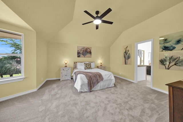 carpeted bedroom with ceiling fan and vaulted ceiling